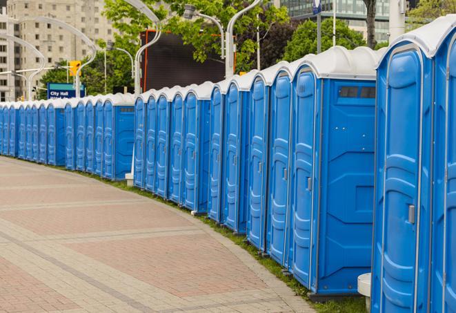 hygienic portable restrooms lined up at a music festival, providing comfort and convenience for attendees in Bedford Heights, OH