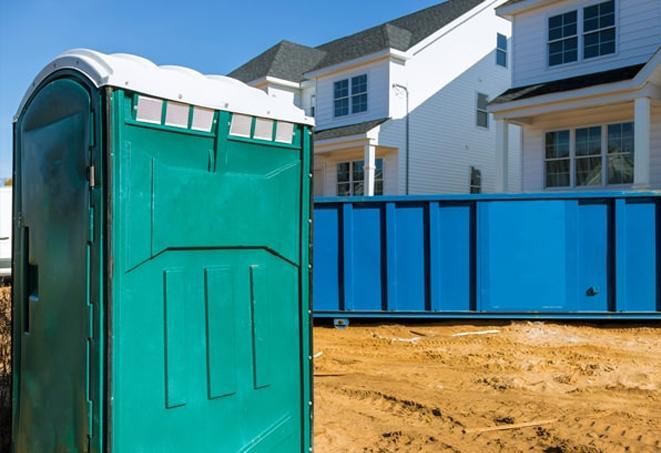 a portable toilet lineup at an active job site